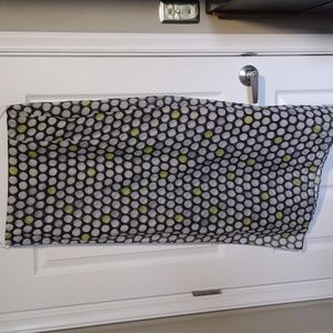 Large scarf navy background with white and a few green polka dots.